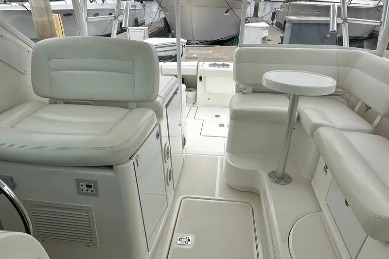 Slide: The Image of 2007 Tiara Yachts 3600 interior with white seating and compact table. - 12