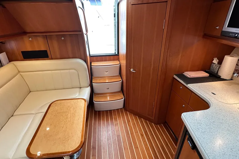Slide: The Image of Luxurious 2007 Tiara Yachts 3600 interior with elegant wood finish and comfortable seating. - 14