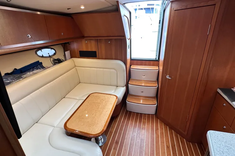 Slide: The Image of Luxurious 2007 Tiara Yachts 3600 interior with elegant wood finish and comfortable seating. - 16
