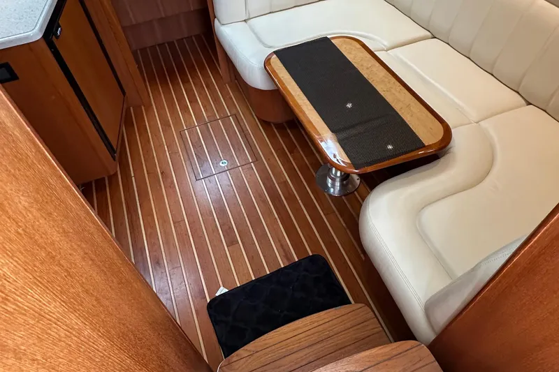 Slide: The Image of Luxurious 2007 Tiara Yachts 3600 interior with wood flooring and elegant seating area. - 17