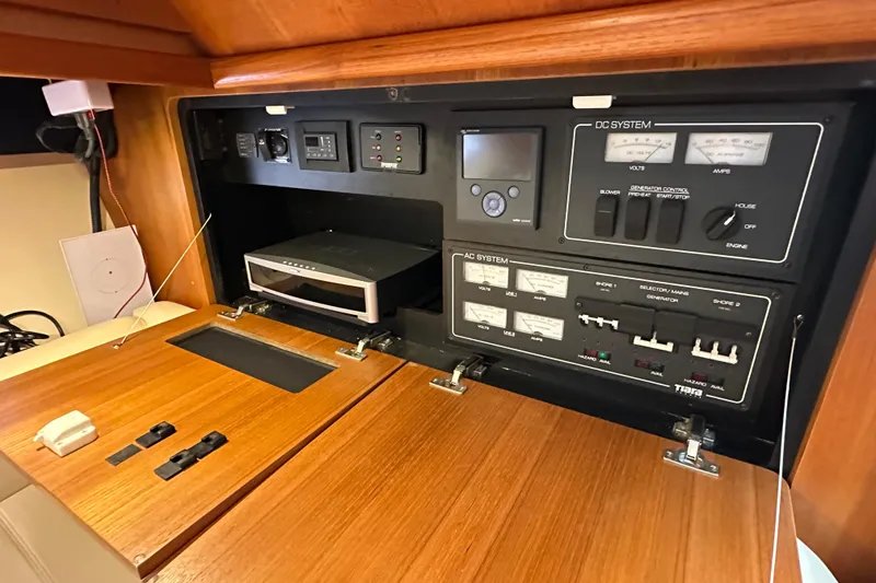 Slide: The Image of Control panel of a 2007 Tiara Yachts 3600, featuring AC and DC systems. - 20