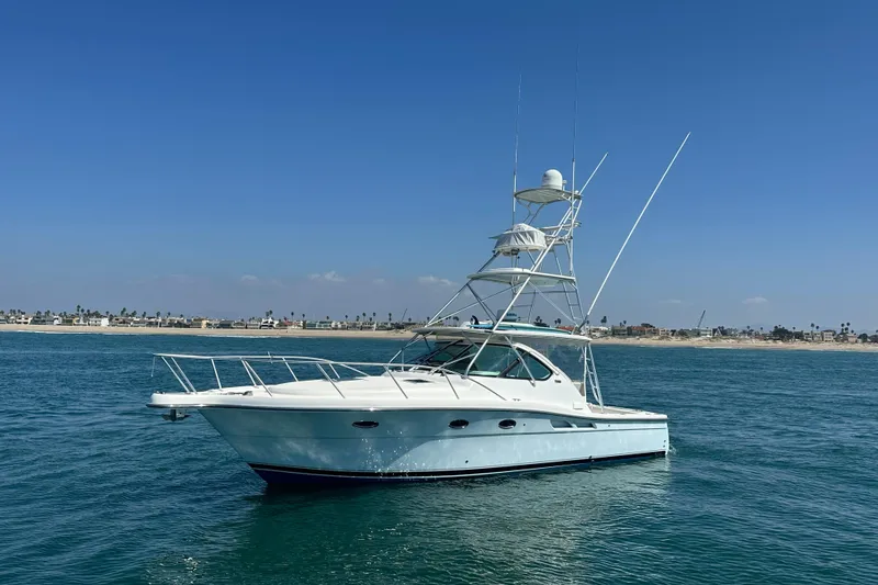 Slide: The Image of 2007 Tiara Yachts 3600 on calm ocean waters under clear blue sky. - 23