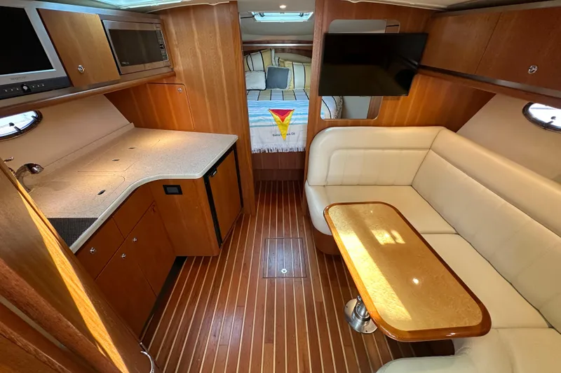 Slide: The Image of Luxurious interior of 2007 Tiara Yachts 3600 Open, featuring a cozy seating area and kitchenette. - 25