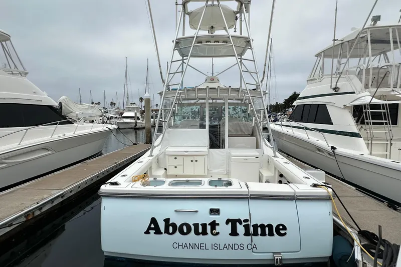 Slide: The Image of 2007 Tiara Yachts 3600 docked at Channel Islands marina, named "About Time". - 3