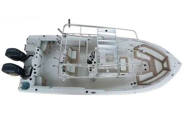 Slide: The Image of 2015 Sailfish 270 CC boat covered on trailer, parked outdoors in autumn setting. - 18