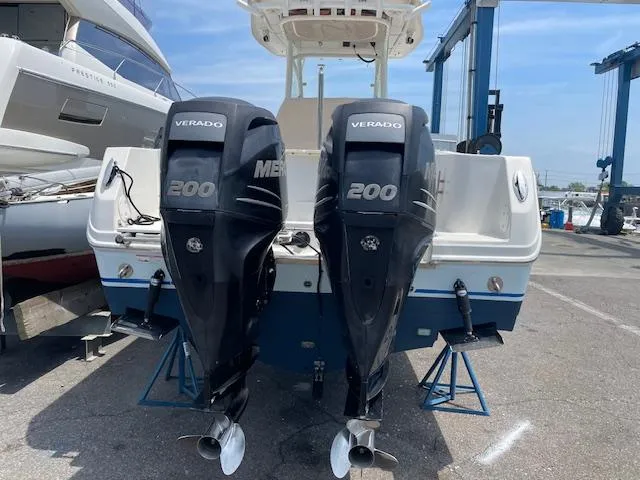 Slide: The Image of 2015 Sailfish 270 CC boat on dry dock, registration NY 1344 ML visible. - 2