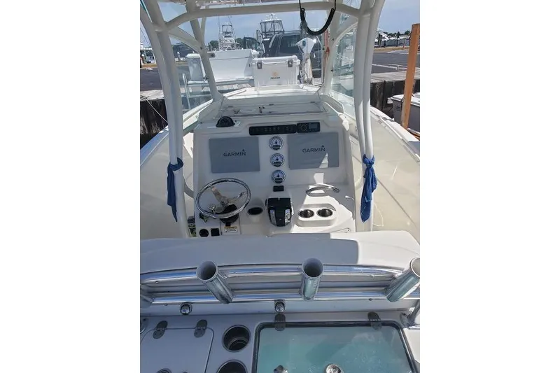 Slide: The Image of 2015 Sailfish 270 CC boat dashboard with Garmin navigation and control instruments. - 6