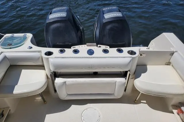 Slide: The Image of 2015 Sailfish 270 CC boat cockpit with Garmin electronics and fishing rod holders. - 7