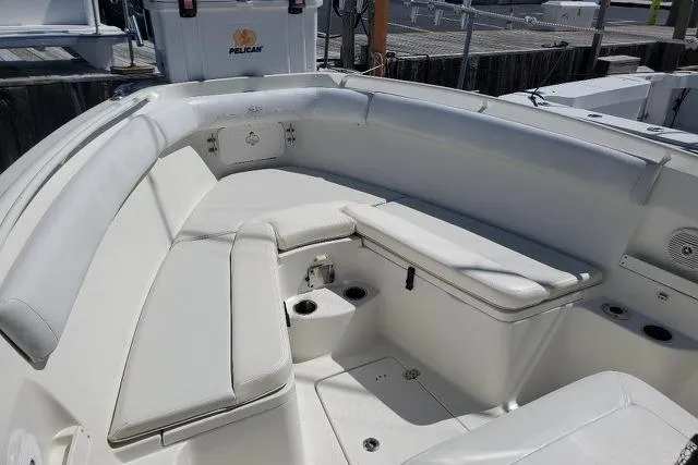 Slide: The Image of 2015 Sailfish 270 CC boat with dual outboard motors on water. - 8