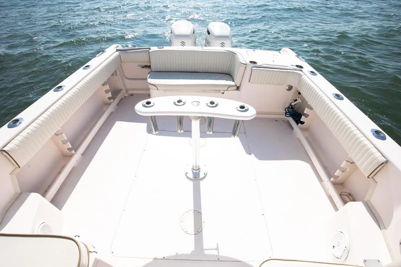 Slide: The Image of 1997 Grady-White Marlin 300 boat on ocean near coastline. - 25