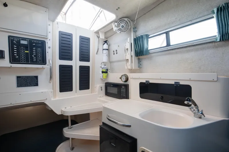 Slide: The Image of 1997 Grady-White Marlin 300 boat deck with seating, on open water. - 54