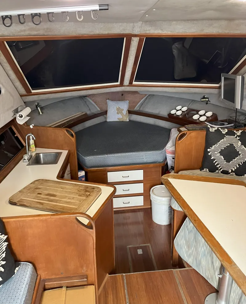 Slide: The Image of Interior of a 1988 Pacemaker 308 boat with cozy cabin and kitchenette. - 13