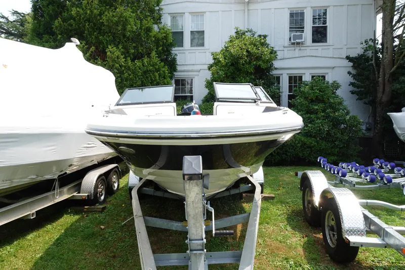 Slide: The Image of 2016 Sea Ray SPX 190 Outboard boat on trailer, parked on grass. - 3