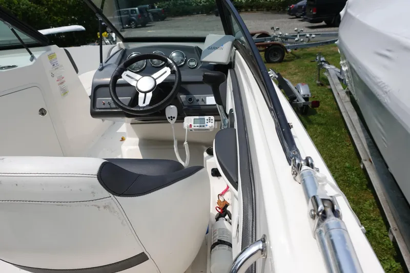 Slide: The Image of 2016 Sea Ray SPX 190 Outboard boat interior with steering wheel and dashboard controls. - 6