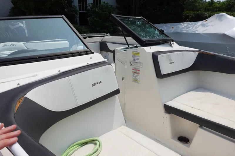 Slide: The Image of 2016 Sea Ray SPX 190 Outboard interior with seating and windshield. - 8