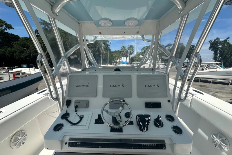 Slide: The Image of 2015 SeaHunter 41 Tournament boat helm with Garmin navigation system and controls. - 11