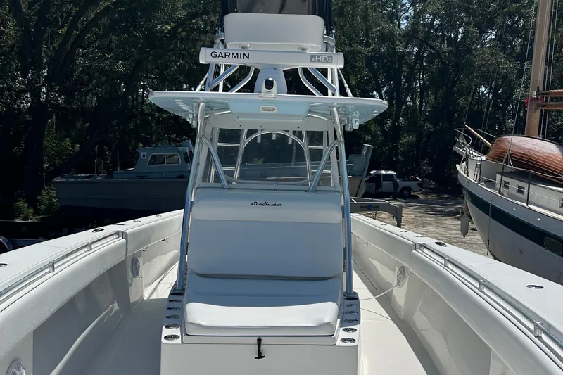 Slide: The Image of 2015 SeaHunter 41 Tournament boat with Garmin equipment, docked in a marina setting. - 6