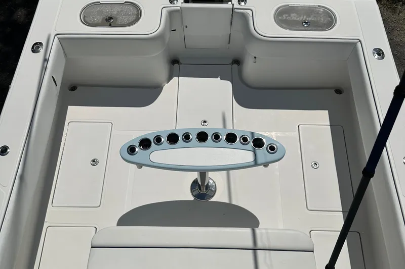 Slide: The Image of 2015 SeaHunter 41 Tournament boat deck with rod holders and storage compartments. - 7