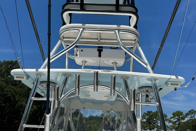 Slide: The Image of 2015 SeaHunter 41 Tournament boat tower with fishing rod holders under clear blue sky. - 8