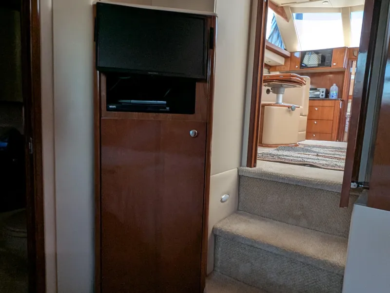 Slide: The Image of Interior of 2006 Meridian 368 yacht with TV and steps to cabin. - 15