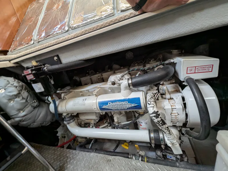 Slide: The Image of Engine compartment of a 2006 Meridian 368 yacht, featuring a Diamond Performance Series engine. - 16