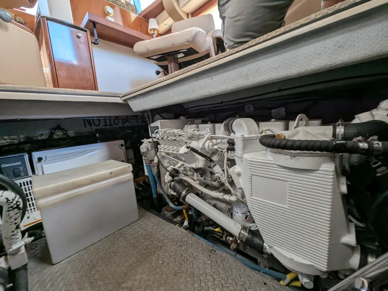 Slide: The Image of Engine room of a 2006 Meridian 368 yacht, showcasing machinery and equipment. - 17