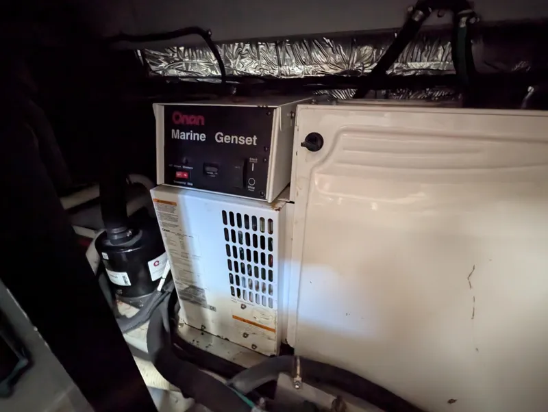 Slide: The Image of Onan Marine Genset in 2006 Meridian 368 engine room, showing generator and surrounding components. - 19