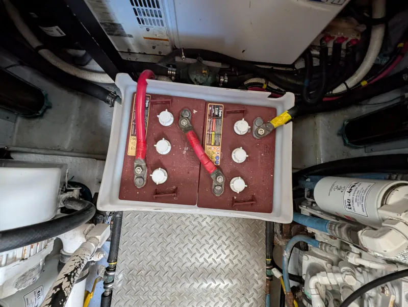 Slide: The Image of Battery compartment of a 2006 Meridian 368 yacht, featuring cables and connections. - 20
