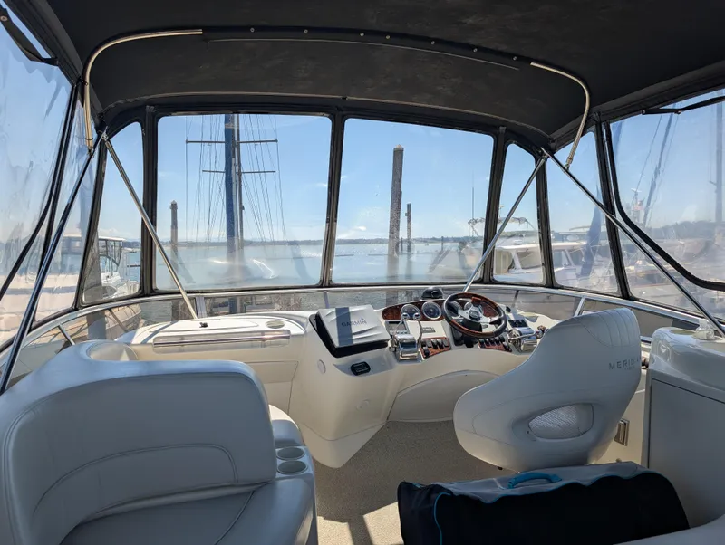 Slide: The Image of Interior view of a 2006 Meridian 368 yacht cockpit with steering wheel and navigation equipment. - 21