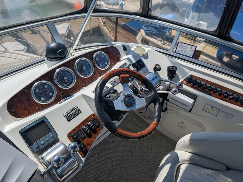 Slide: The Image of Helm of 2006 Meridian 368 yacht with steering wheel and control panel. - 22