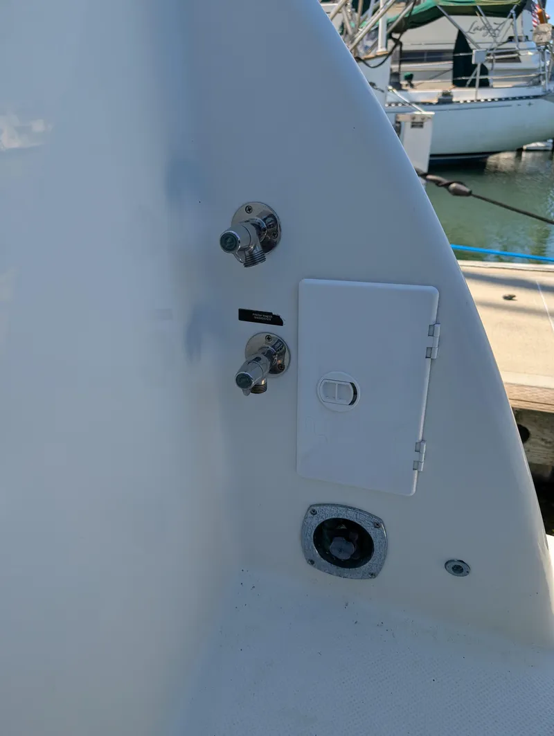 Slide: The Image of 2006 Meridian 368 yacht deck fittings and access panel at marina. - 27