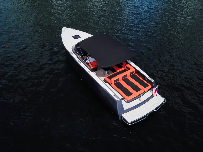 The Image of VanDutch 30 yacht, 2016 model, with sleek design and orange seating, cruising on water. - 0