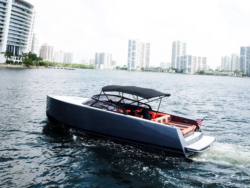 Slide: The Image of 2016 VanDutch 30 yacht cruising near modern city skyline. - 21