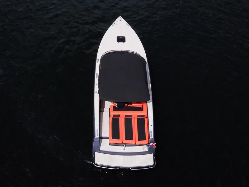 Slide: The Image of Aerial view of 2016 VanDutch 30 boat with black and orange seating. - 28