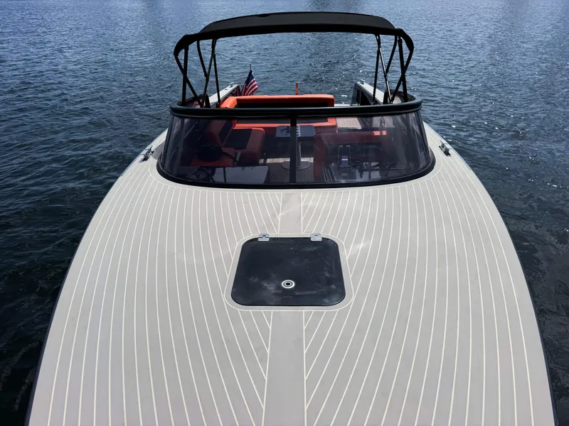 Slide: The Image of 2016 VanDutch 30 yacht on water, featuring sleek design and American flag. - 29