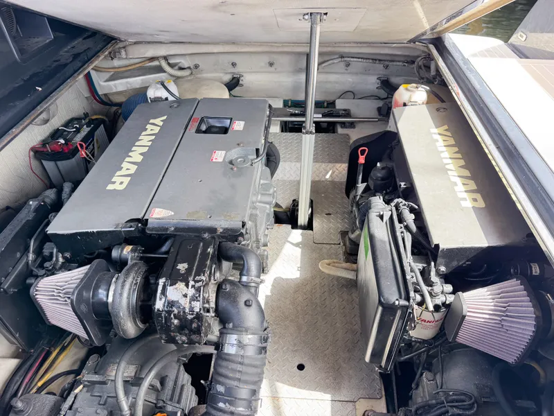 Slide: The Image of Engine compartment of a 2016 VanDutch 30 with dual Yanmar engines. - 37