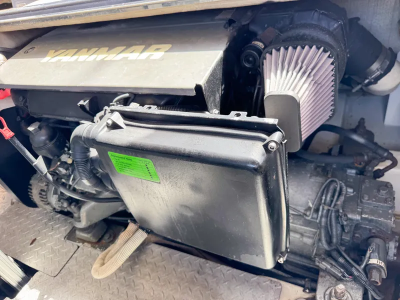 Slide: The Image of Yanmar engine in a 2016 VanDutch 30 boat, showcasing mechanical components and air filter. - 38