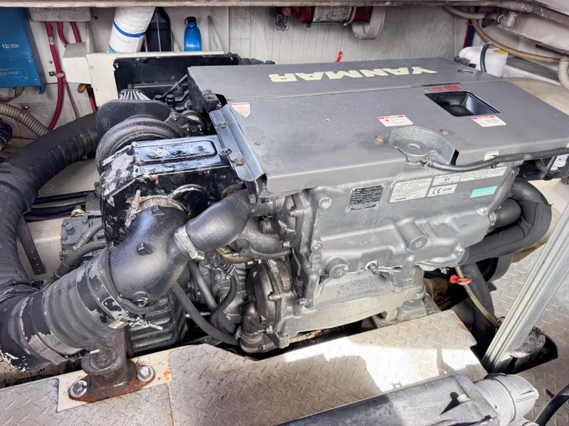 Slide: The Image of Engine compartment of a 2016 VanDutch 30 boat, featuring a Yanmar engine. - 39