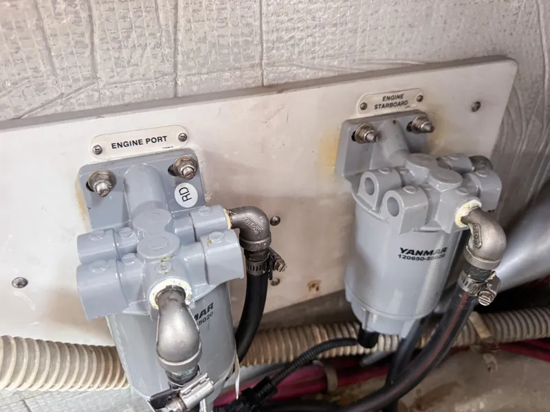 Slide: The Image of Engine components of a 2016 VanDutch 30, featuring Yanmar filters for port and starboard engines. - 41