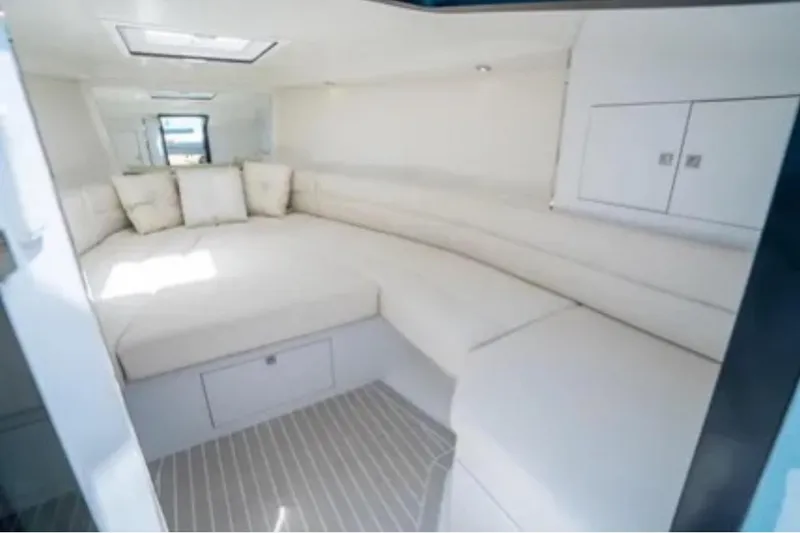 Slide: The Image of Luxurious interior of 2016 VanDutch 30 yacht with plush white seating. - 42