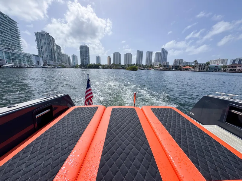 Slide: The Image of 2016 VanDutch 30 yacht cruising in urban waterfront, skyscrapers in background. - 5