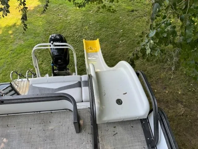 Slide: The Image of Pontoon boat with slide, Crest Caribbean 250 L, 2017 model, parked on grass. - 10