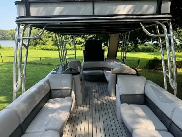 Slide: The Image of 2017 Crest Caribbean 250 L pontoon boat with spacious seating and scenic lake view. - 5