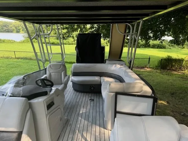 Slide: The Image of 2017 Crest Caribbean 250 L pontoon boat with spacious seating and scenic outdoor view. - 7