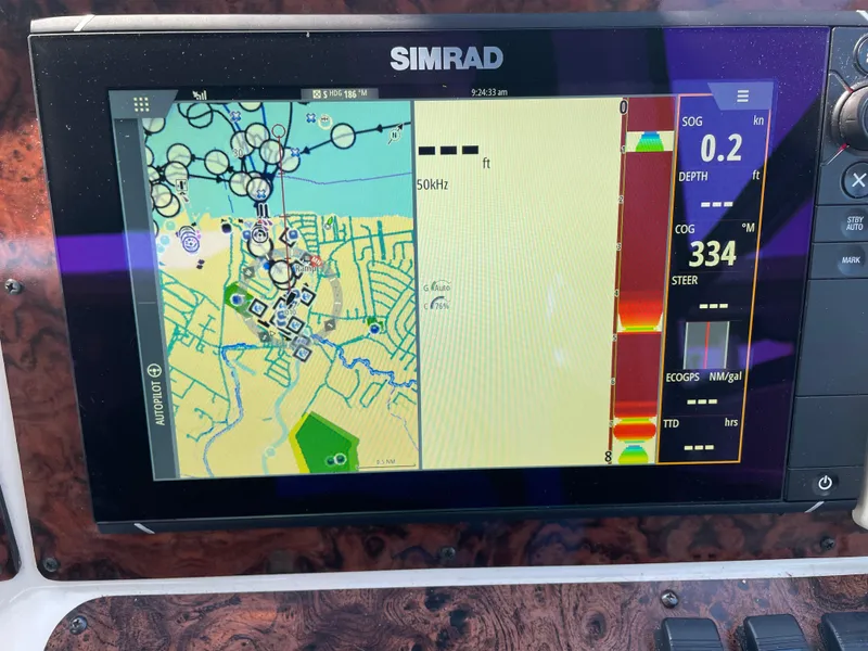 Slide: The Image of Simrad navigation display on 1997 Sea Ray 330 Express boat, showing map and data. - 21