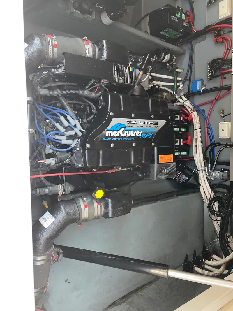 Slide: The Image of Engine compartment of a 1997 Sea Ray 330 Express with MerCruiser 7.4L MPI engine. - 27