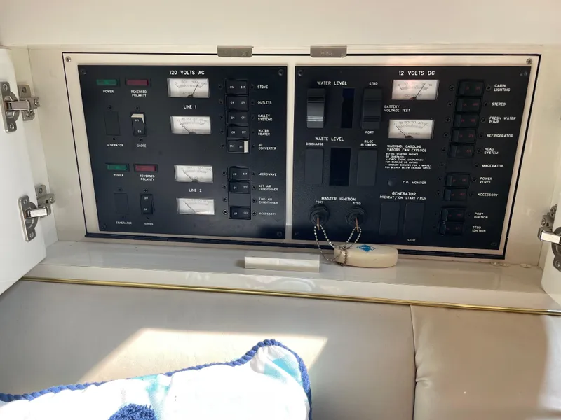 Slide: The Image of Electrical control panel on a 1997 Sea Ray 330 Express boat. - 37