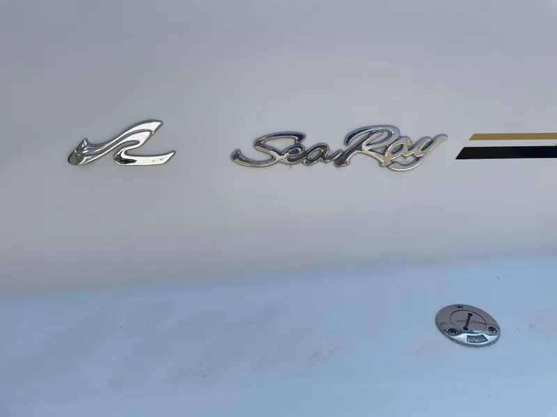 Slide: The Image of 1997 Sea Ray 330 Express logo on boat hull. - 38