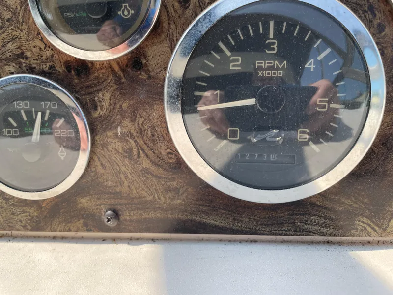 Slide: The Image of Close-up of 1997 Sea Ray 330 Express boat dashboard gauges. - 41