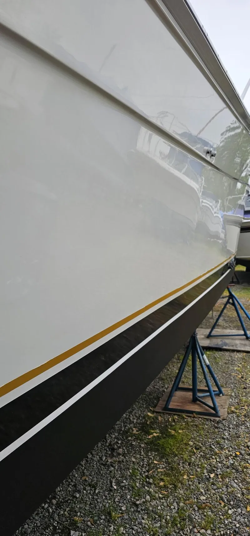 Slide: The Image of 1997 Sea Ray 330 Express boat hull on stands, side view. - 46